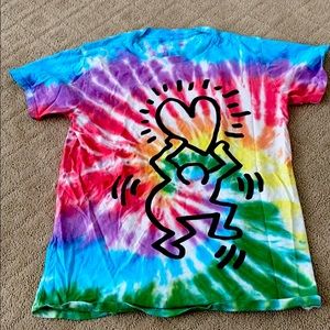 A rainbow tie-dye shirt with a person with a heart